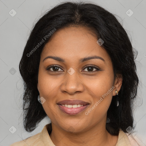 Joyful black adult female with medium  brown hair and brown eyes