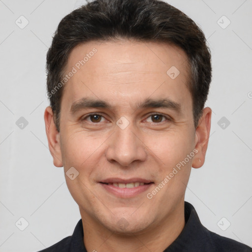 Joyful white adult male with short  brown hair and brown eyes