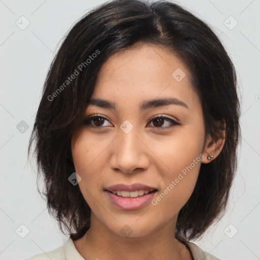 Joyful latino young-adult female with medium  brown hair and brown eyes