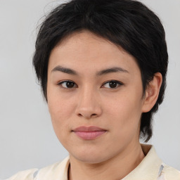 Joyful asian young-adult female with medium  brown hair and brown eyes