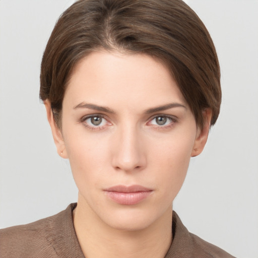 Neutral white young-adult female with short  brown hair and brown eyes