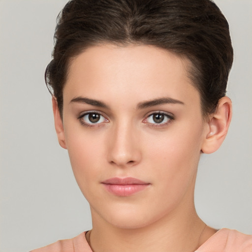 Neutral white young-adult female with short  brown hair and brown eyes