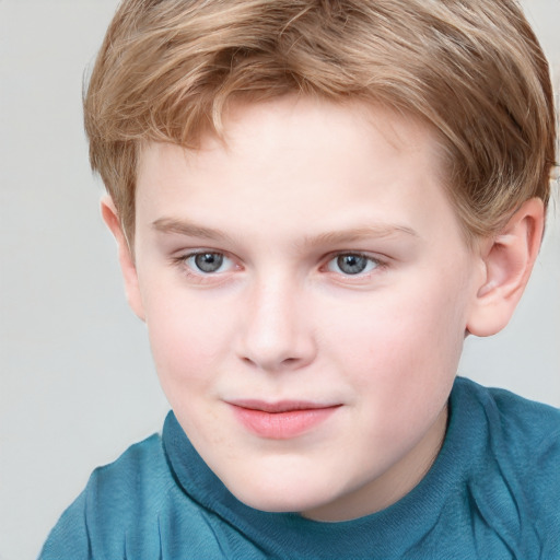 Joyful white child male with short  brown hair and blue eyes