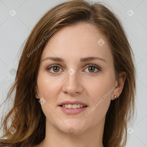 Joyful white young-adult female with long  brown hair and green eyes