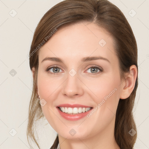 Joyful white young-adult female with medium  brown hair and blue eyes