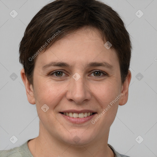 Joyful white young-adult female with short  brown hair and grey eyes