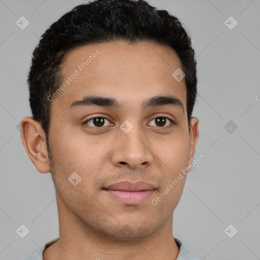 Joyful latino young-adult male with short  brown hair and brown eyes