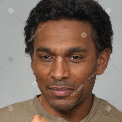 Joyful latino adult male with short  black hair and brown eyes