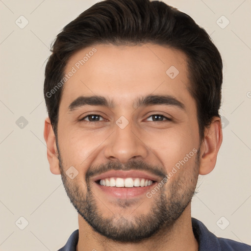 Joyful white young-adult male with short  black hair and brown eyes