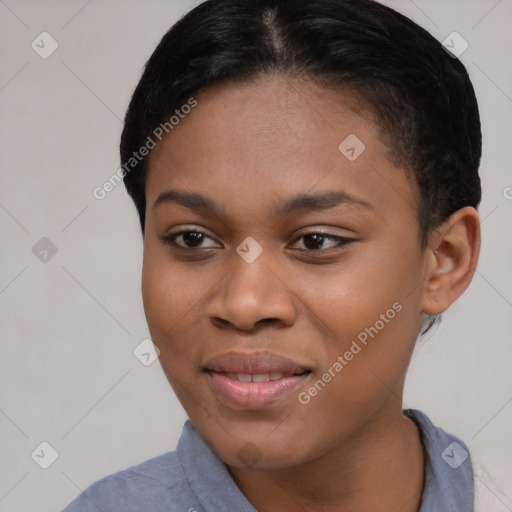 Joyful black young-adult female with short  brown hair and brown eyes