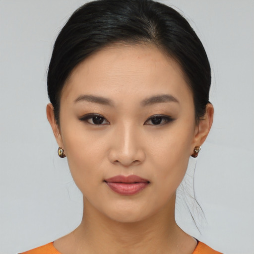 Joyful asian young-adult female with short  black hair and brown eyes