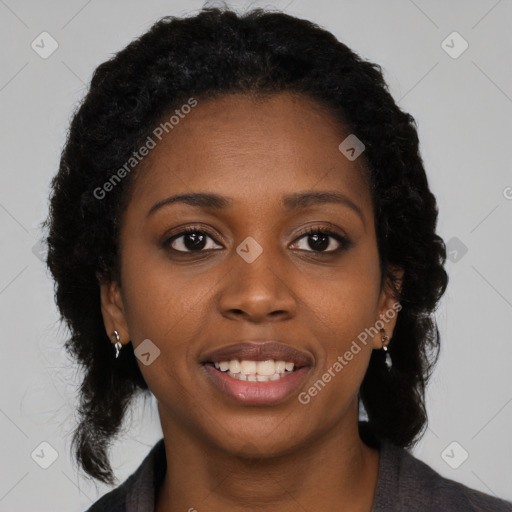 Joyful black young-adult female with long  brown hair and brown eyes