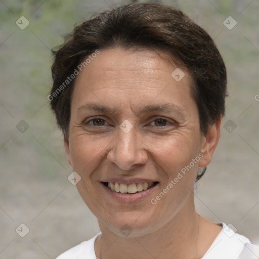 Joyful white adult female with short  brown hair and brown eyes