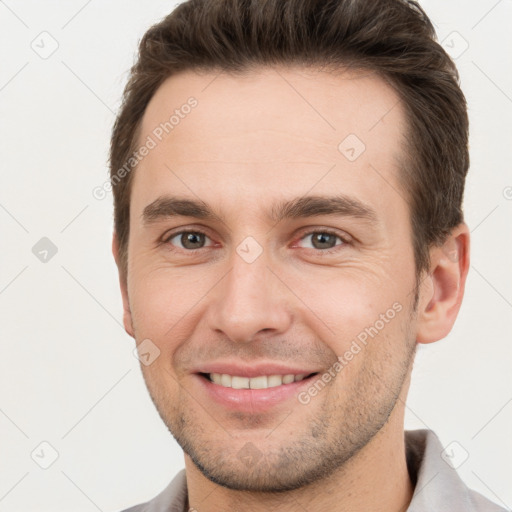 Joyful white young-adult male with short  brown hair and brown eyes