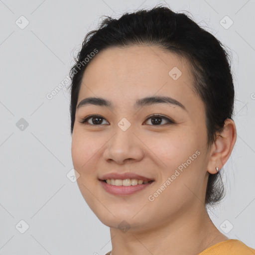 Joyful asian young-adult female with medium  black hair and brown eyes