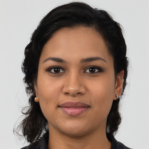 Joyful latino young-adult female with medium  black hair and brown eyes