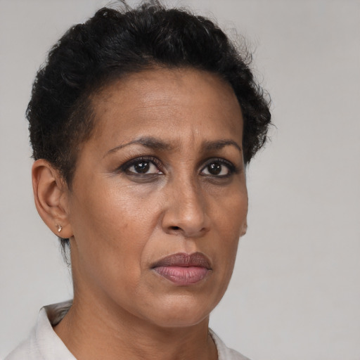 Neutral black adult female with short  brown hair and brown eyes