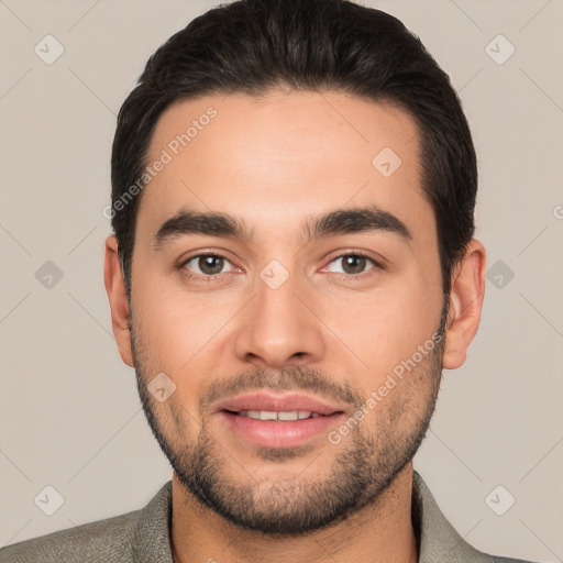 Joyful white young-adult male with short  black hair and brown eyes