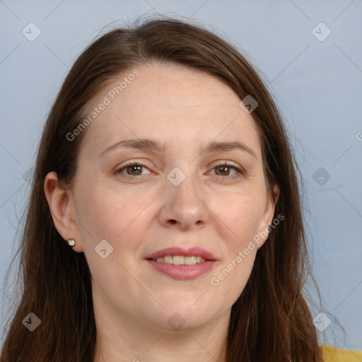 Joyful white adult female with long  brown hair and grey eyes