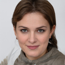 Joyful white young-adult female with medium  brown hair and grey eyes