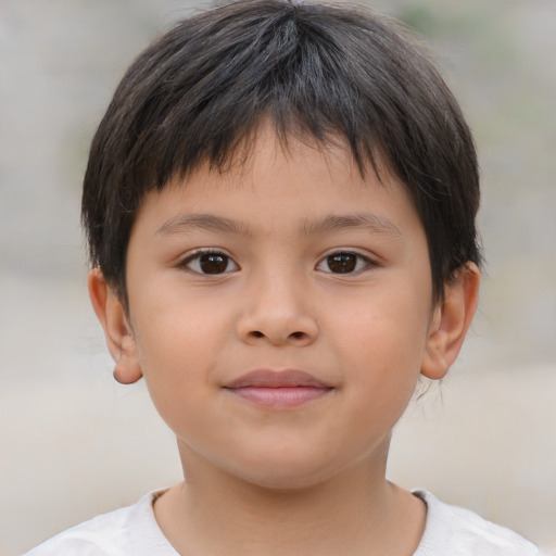 Joyful asian child male with short  brown hair and brown eyes