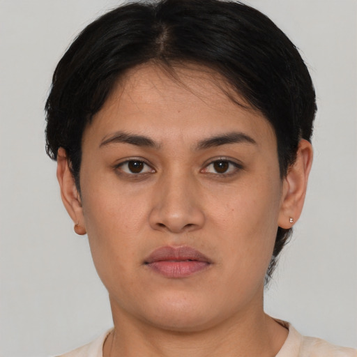 Neutral latino young-adult female with short  black hair and brown eyes