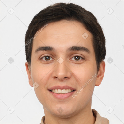 Joyful white young-adult male with short  brown hair and brown eyes