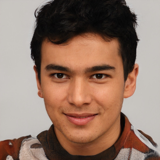 Joyful latino young-adult male with short  brown hair and brown eyes