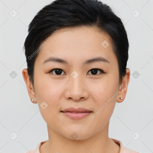 Joyful asian young-adult female with short  black hair and brown eyes