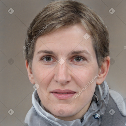 Joyful white adult female with short  brown hair and grey eyes