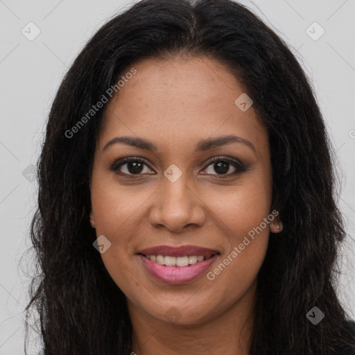 Joyful black young-adult female with long  brown hair and brown eyes