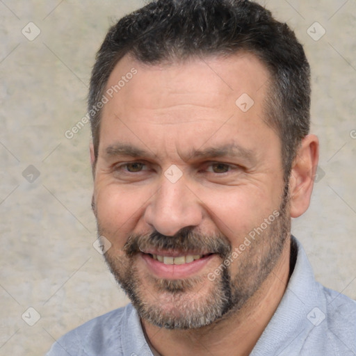 Joyful white adult male with short  black hair and brown eyes