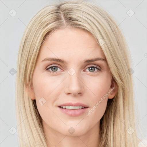 Joyful white young-adult female with long  brown hair and blue eyes