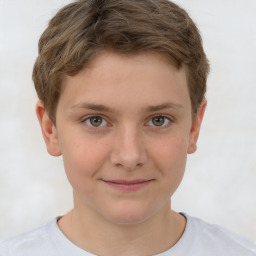 Joyful white child male with short  brown hair and brown eyes