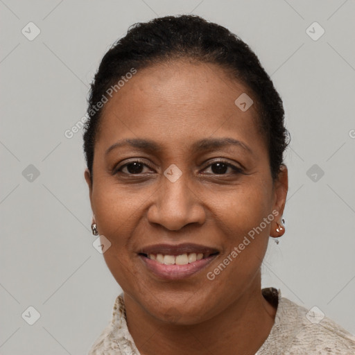 Joyful black adult female with short  black hair and brown eyes