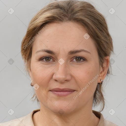 Joyful white adult female with medium  brown hair and brown eyes