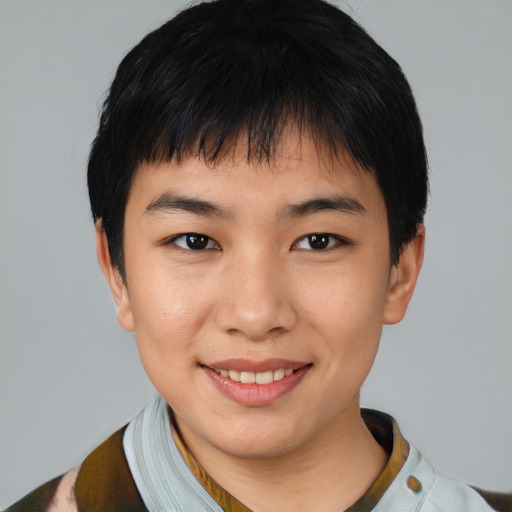 Joyful asian young-adult male with short  black hair and brown eyes