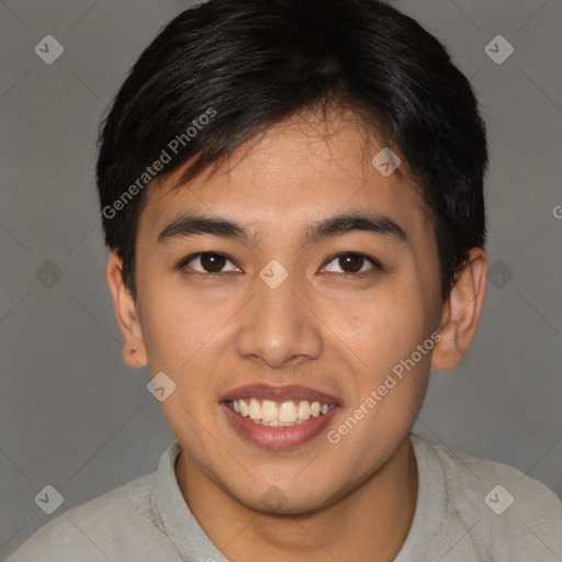 Joyful asian young-adult male with short  brown hair and brown eyes