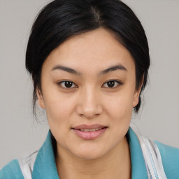 Joyful asian young-adult female with medium  brown hair and brown eyes