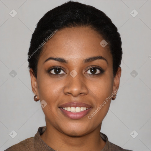 Joyful black young-adult female with short  black hair and brown eyes