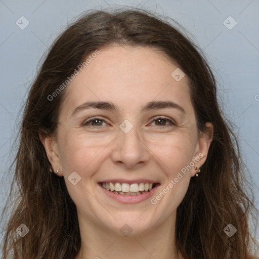 Joyful white adult female with long  brown hair and brown eyes