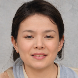 Joyful white child female with medium  brown hair and brown eyes