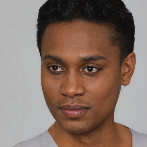 Neutral black young-adult male with short  black hair and brown eyes