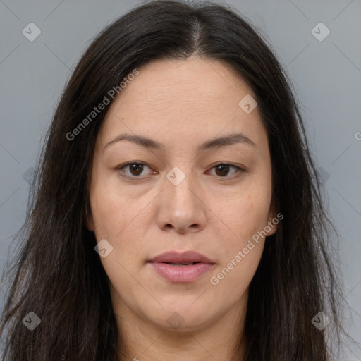 Joyful white adult female with long  brown hair and brown eyes