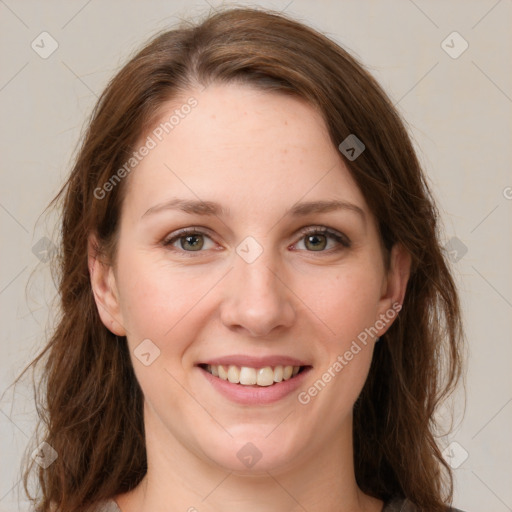 Joyful white young-adult female with long  brown hair and green eyes