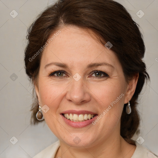 Joyful white adult female with medium  brown hair and grey eyes