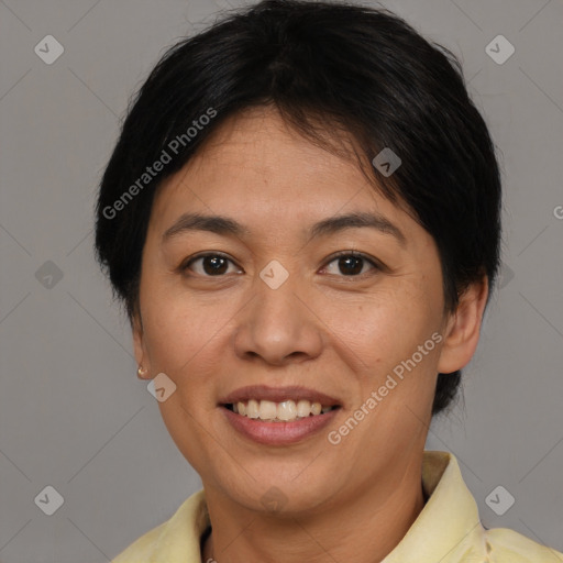 Joyful asian adult female with short  brown hair and brown eyes