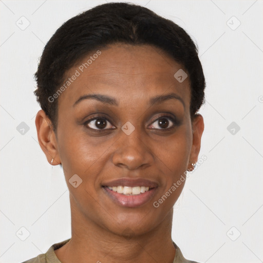 Joyful black young-adult female with short  brown hair and brown eyes