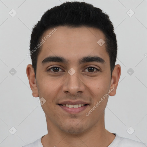 Joyful latino young-adult male with short  black hair and brown eyes