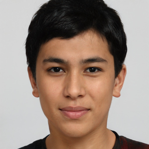 Joyful latino young-adult male with short  brown hair and brown eyes